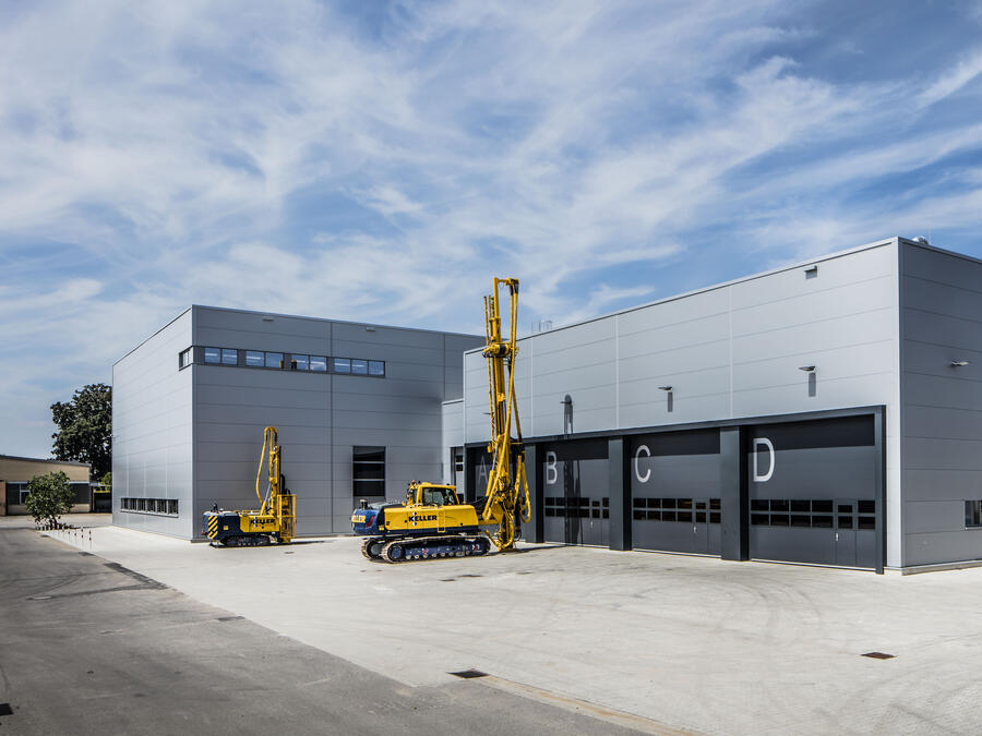 KGS factory exterior with two rigs