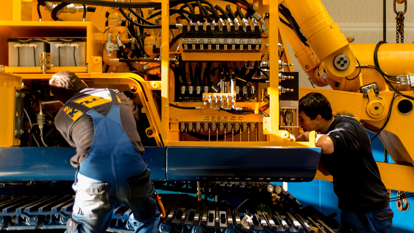 Service technicians maintaining a rig