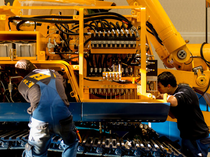 Service technicians maintaining a rig